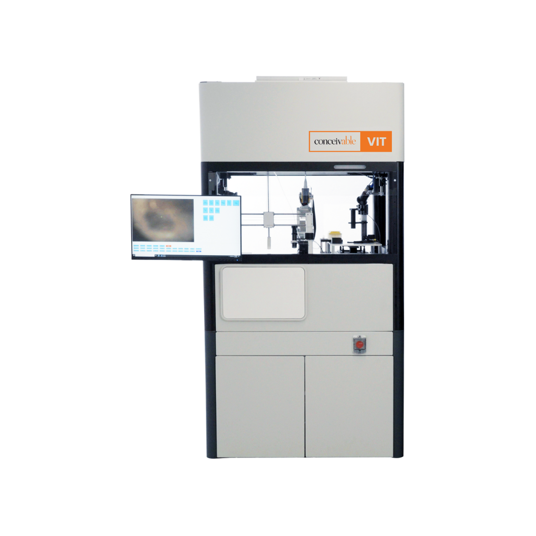 A scientific laboratory machine labeled 'conceivable VIT' with a monitor on the left side displaying a blurred image, and various mechanical parts inside the enclosed workspace.