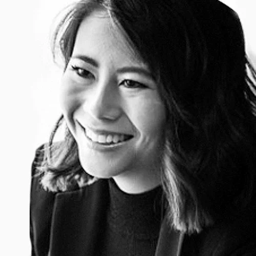 Black and white photo of Aike Ho, wearing a dark top.