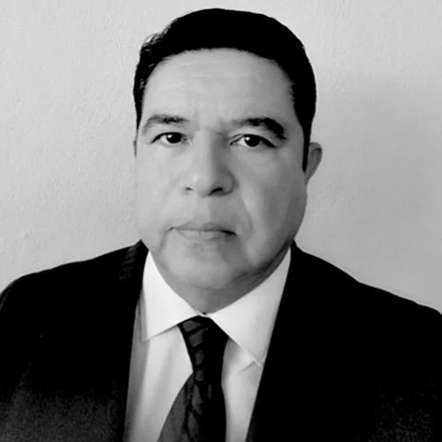 Black and white portrait of Vladimir Ocegueda Hernandez in a suit and tie looking directly at the camera.